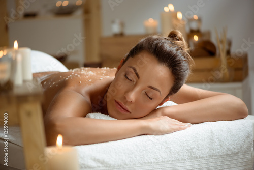 Young beautiful girl relaxing in spa salon.