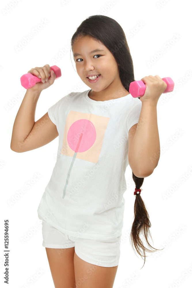 Happy little girl with dumbbells isolated on white background Happy little girl with dumbbells isolated on white background