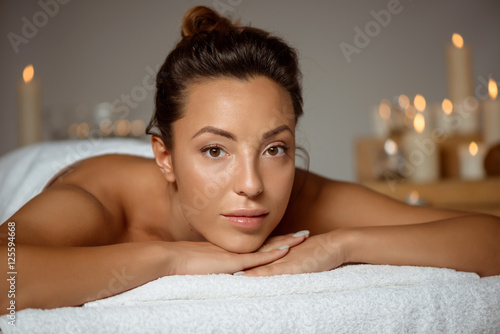 Young beautiful girl relaxing in spa salon.