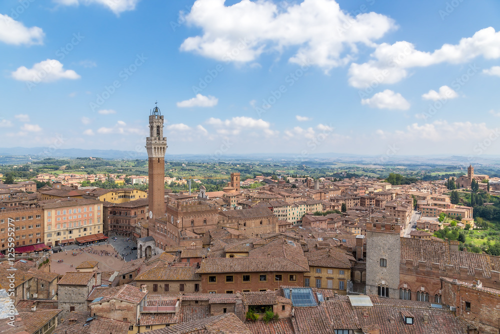 Siena, Italy. View of the old city: on the left - the bell tower Torre del Mangia (1348)
