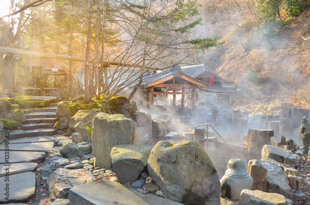 Fototapeta premium Outdoor hot spring with stone walking path, Onsen in japan in Au