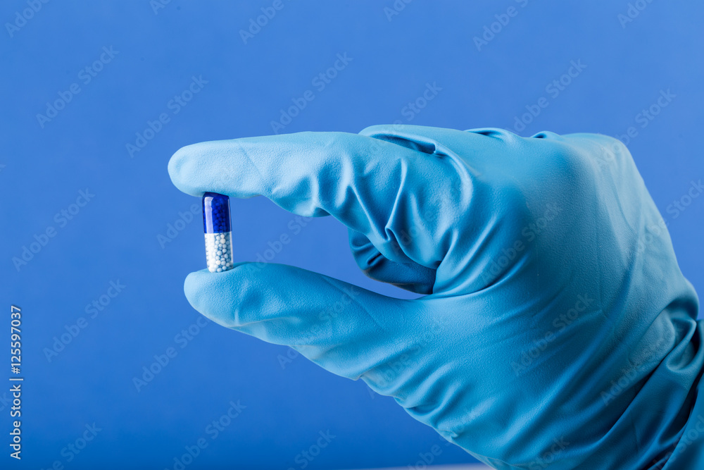 Latex gloves holding medication Latex gloves holding medication