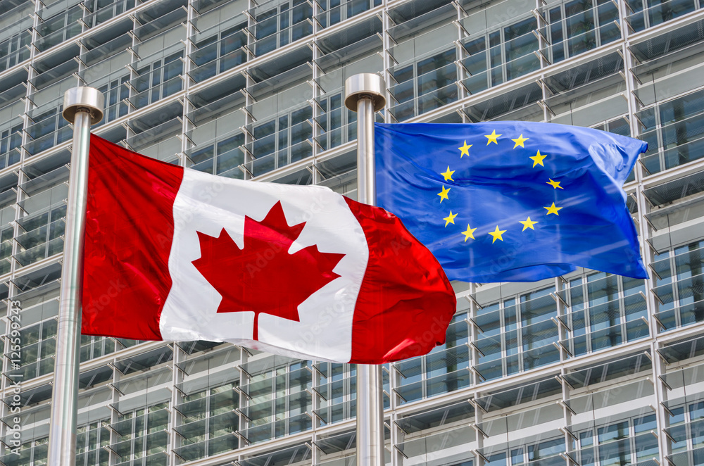 Naklejka premium Canadian and European flags waving in the wind (montage)