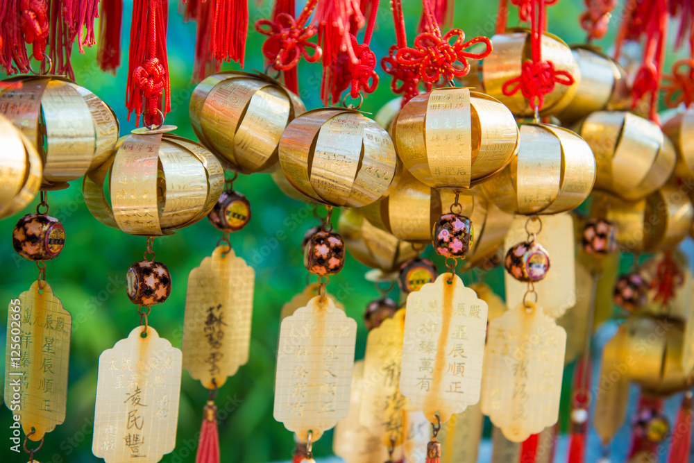 Golden bell at Wong Tai Sin Temple people wish and hang it on ro - obrazy, fototapety, plakaty 