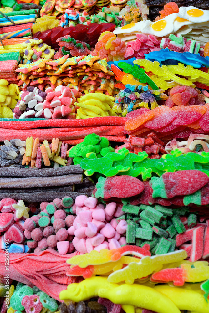Assorted Colorful Candies and sweets in a market. La Boqueria, Barcelona