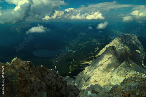 Beautiful view from highest mountain peak Zugspitze near Garmisch Partenkirchen. Summer day with amazing view at several peaks. Bavaria, Germany.