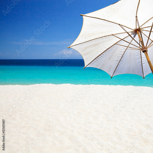 White umbrella on the beach