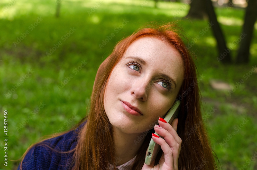 Young woman using her cell phone 