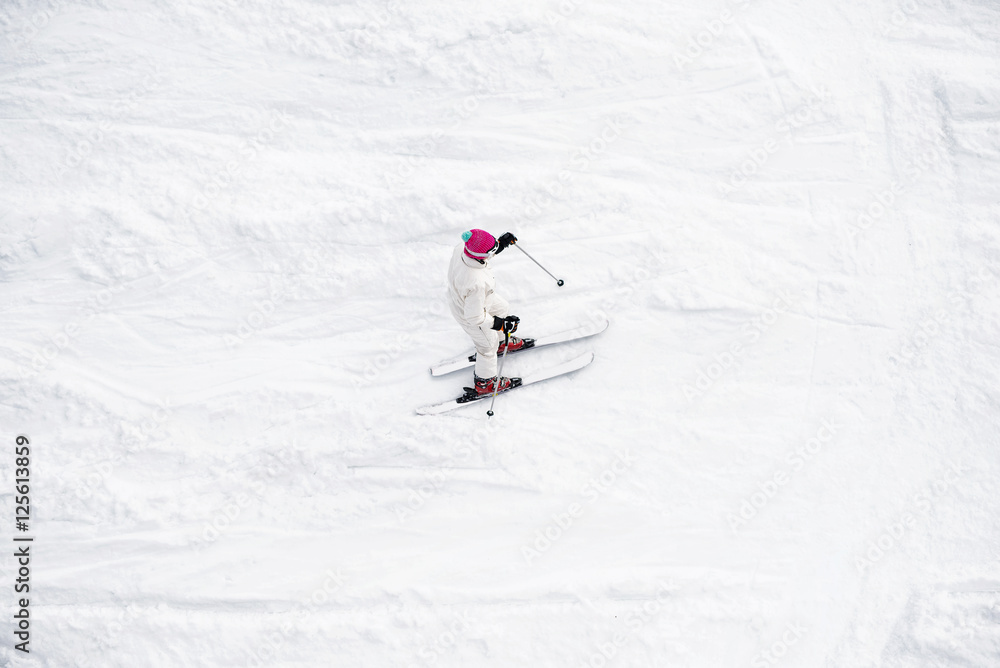 Skier running down the slope. Skier running down the slope.
