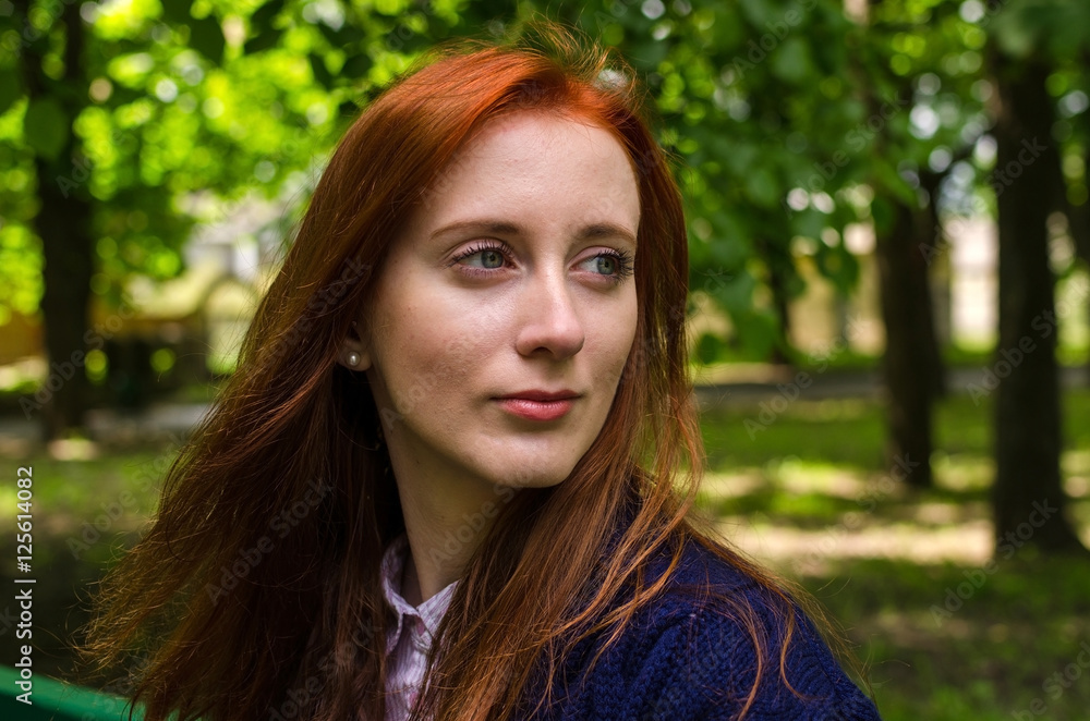 Young red woman walking in the city Young red woman walking in the city