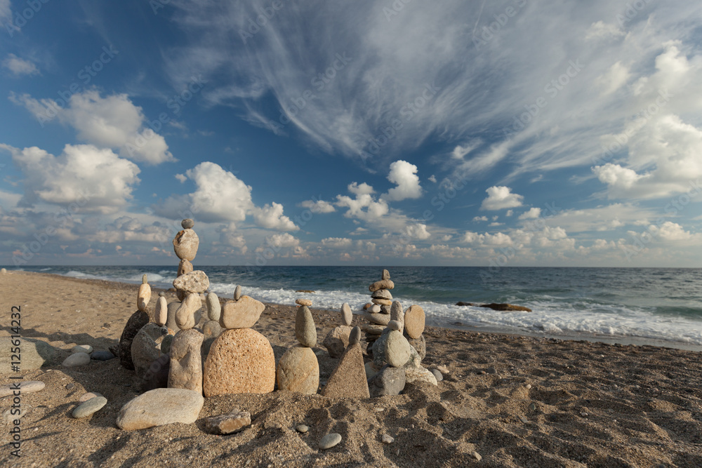 Stack of pebbles balancing on a beach Stack of pebbles balancing on a beach