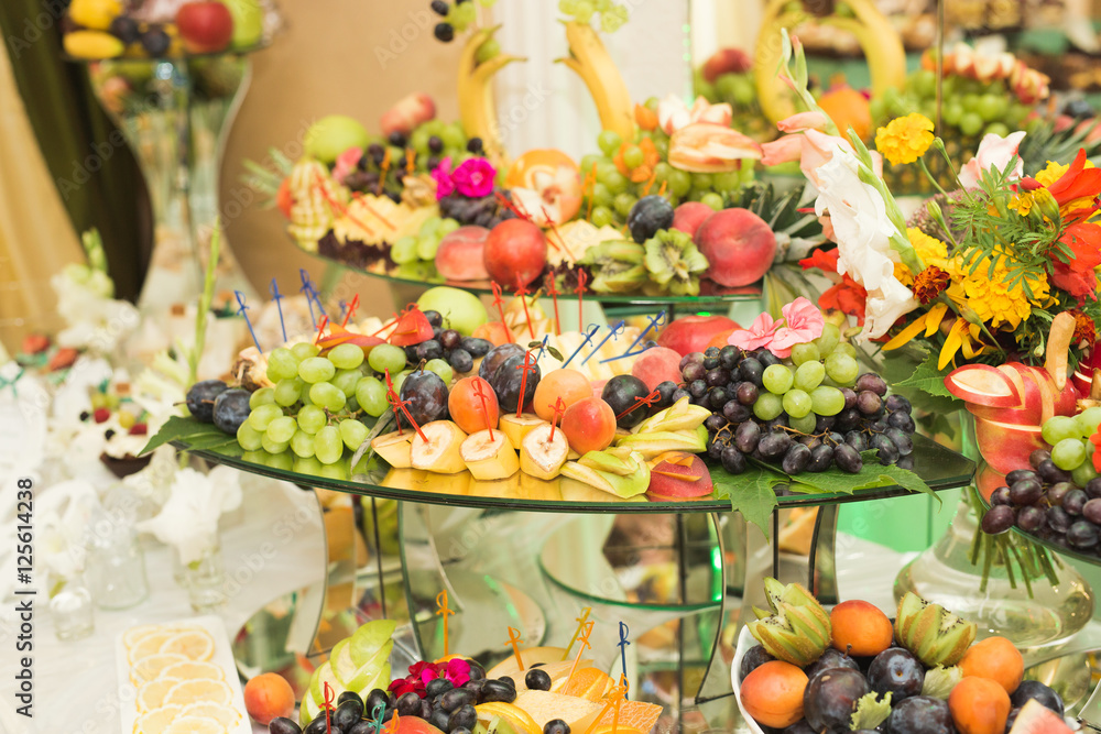 Various sweet sliced fruit on a buffet table