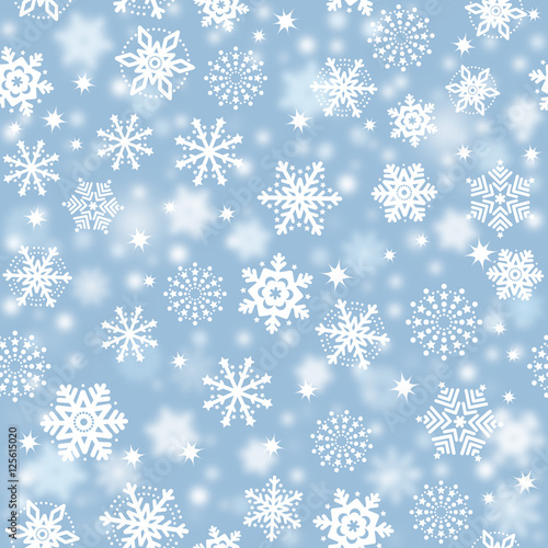 Snowflakes on blue sky, snowstorm - Christmas seamless background 