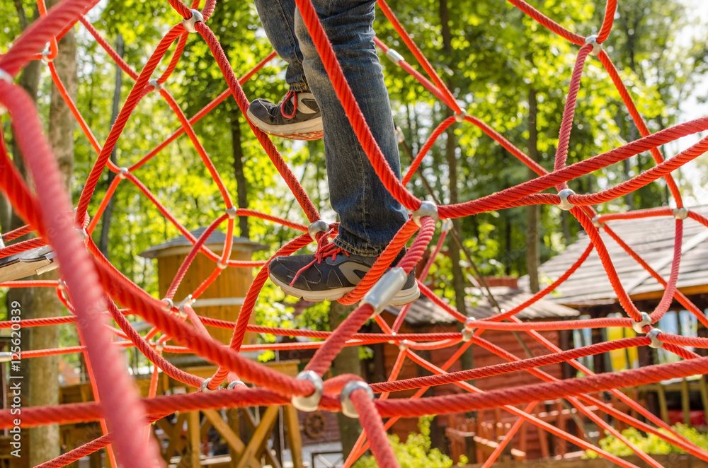 rope park with child playing in it rope park with child playing in it