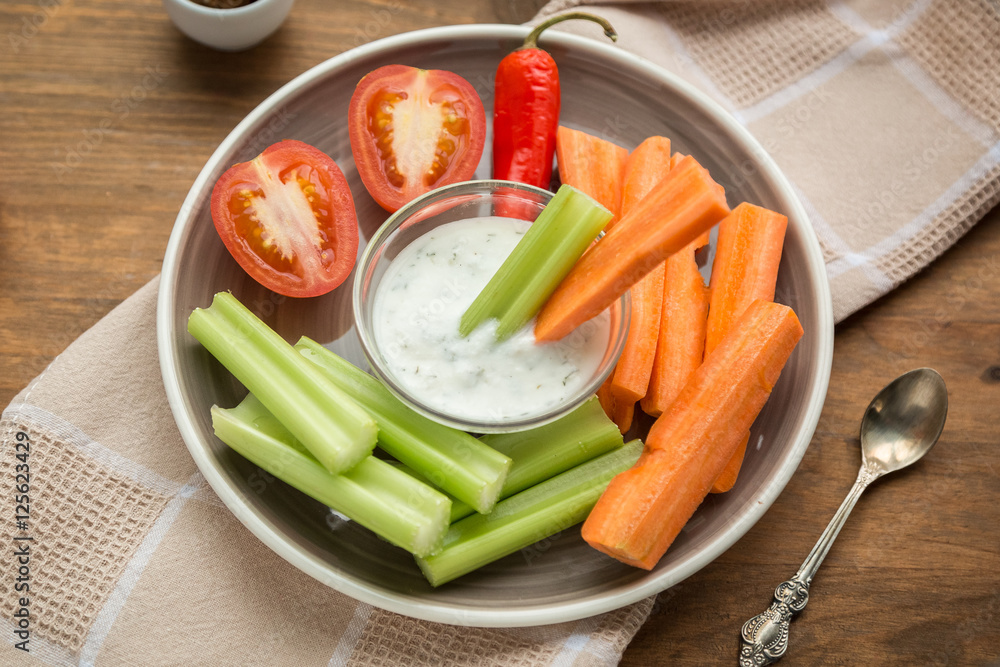 Vegetarian healthy snacks, vegetable snack: carrots, celery, tom