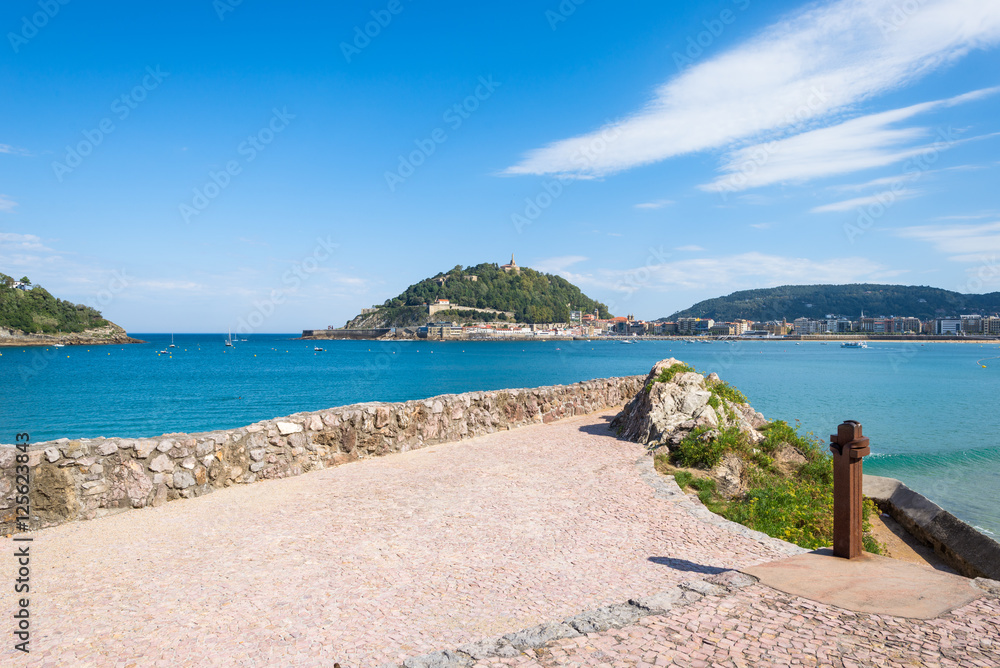 Overlook to the Beach of La Concha Donostia, a sand beach with shallow waters and tide. It is one of the most famous urban beaches in Europe. Donostia San Sebastian is European Capital of Culture 2016 Overlook to the Beach of La Concha Donostia, a sand beach with shallow waters and tide. It is one of the most famous urban beaches in Europe. Donostia San Sebastian is European Capital of Culture 2016