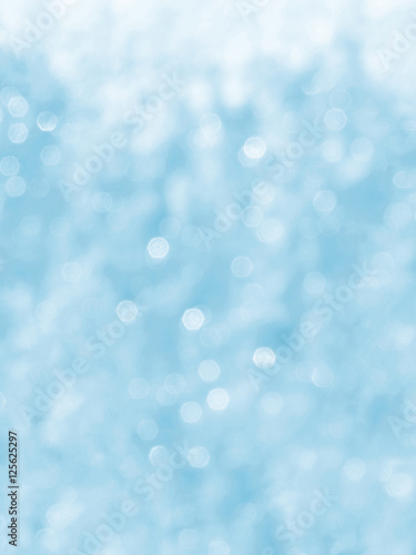 Light blue background, bokeh, vertical