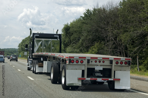 Empty Flatbed Semi on Highway