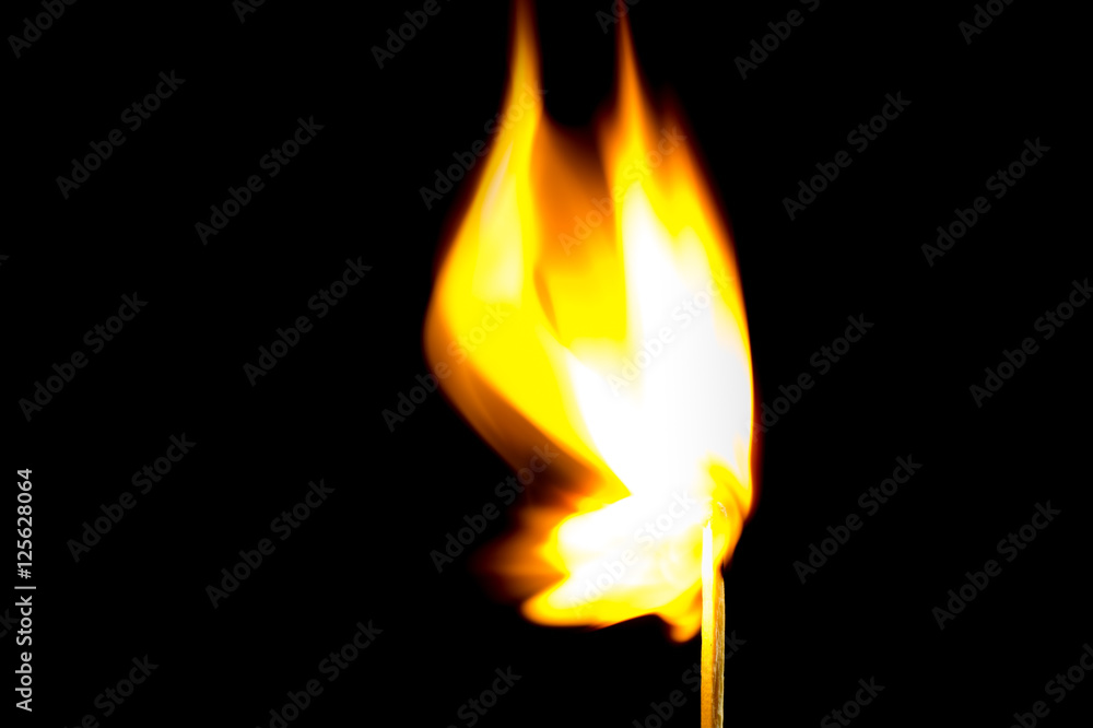 A burning matchstick in the dark environment A burning matchstick in the dark environment