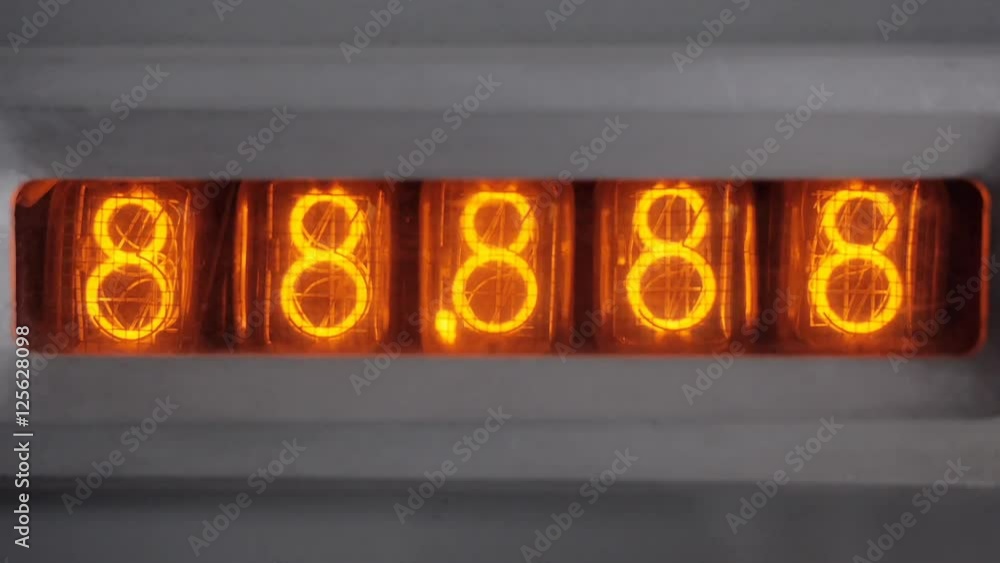 The count on the vacuum tube clock. Switching on the tube timer. The