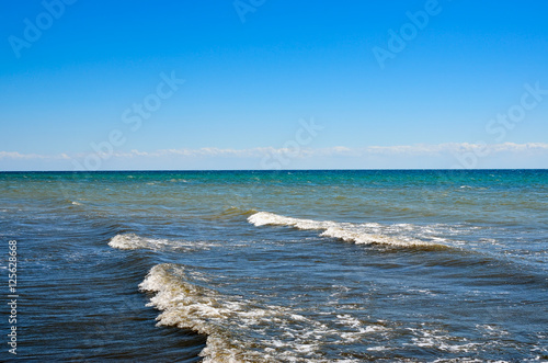 Waves of the Black Sea against the blue sky. Seascape  sea in the summer.