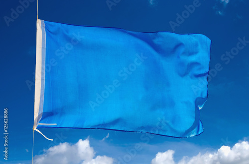 Big blue flag waving