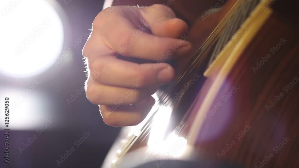 Detail of a guitarist playing classical guitar Detail of a guitarist playing classical guitar