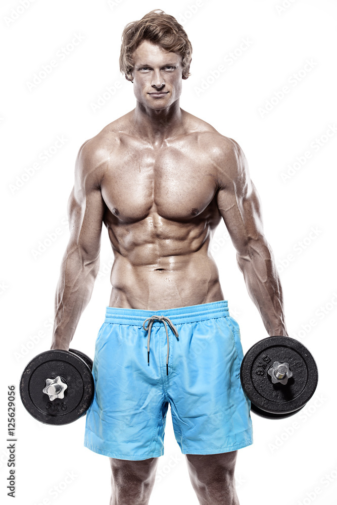 Muscular bodybuilder guy doing exercises with dumbbells Muscular bodybuilder guy doing exercises with dumbbells
