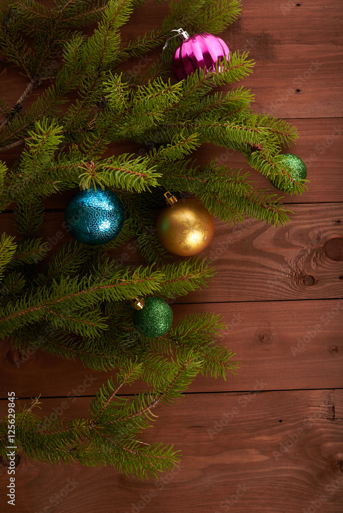Christmas tree and decorations on wooden background