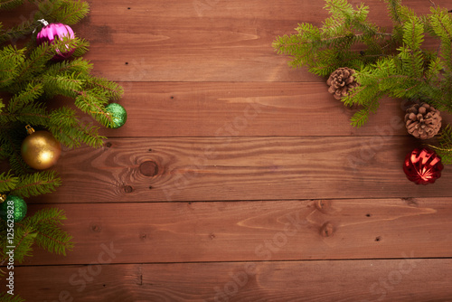 Christmas tree and decorations on wooden background