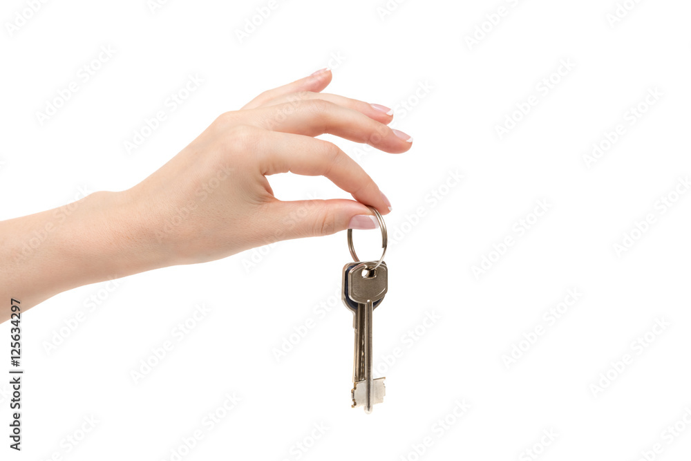 Female hand holds keys on white background. Female hand holds keys on white background.