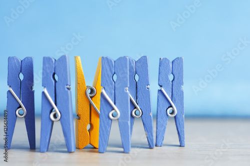 colorful wooden clothespin - selective focus, standing out from the crowd, leadership, difference concept. personality stand out from the mass, selective focus image