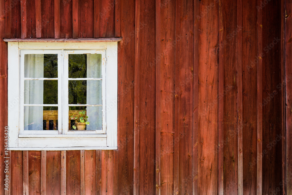 White window of a wooden house in Sweden White window of a wooden house in Sweden