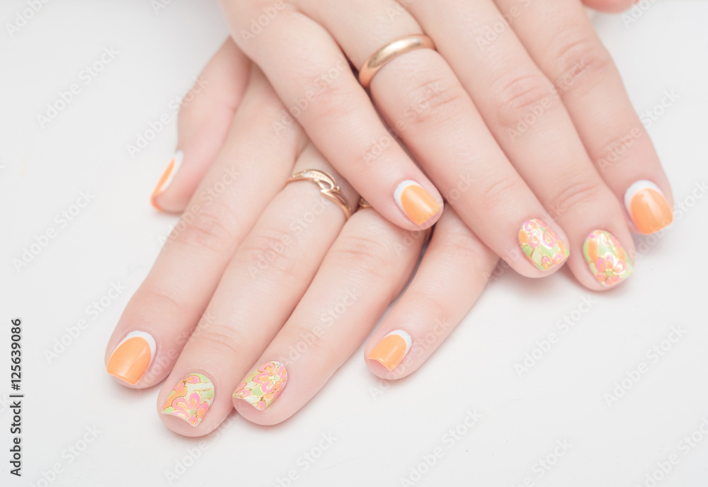 Multi-colored jelly sweets in the hands with a bright nail polish Multi-colored jelly sweets in the hands with a bright nail polish