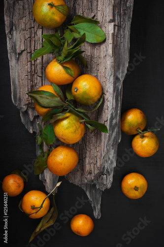 Yellow mandarins on the table