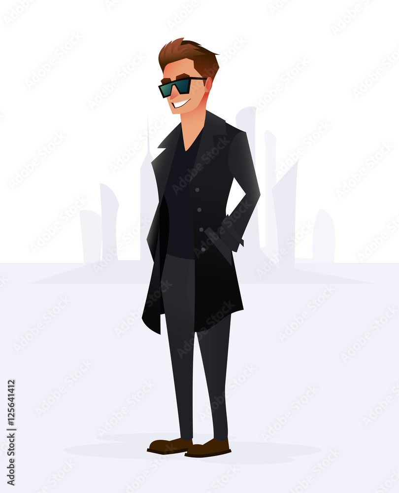 Cheerful smiling boy standing in a black coat autumn fashion Cheerful smiling boy standing in a black coat autumn fashion