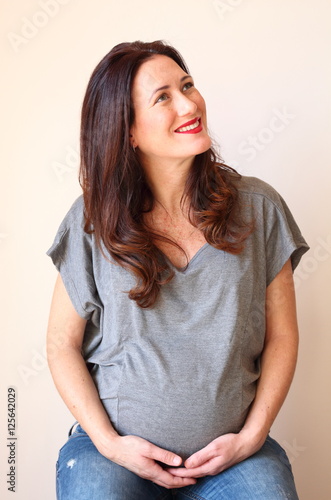 Portrait of a young beautiful pregnant woman.