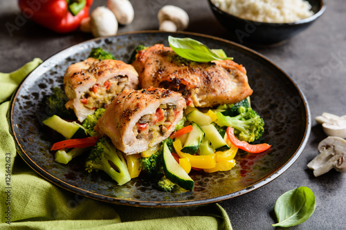Quadro em tela Roasted chicken breasts stuffed with vegetable and sheep cheese, served with ste