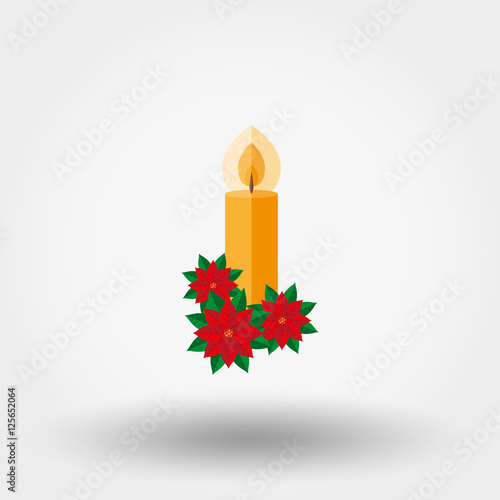 Christmas candle decorated with fir twigs and poinsettia