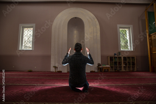 Muslim praying in mosque