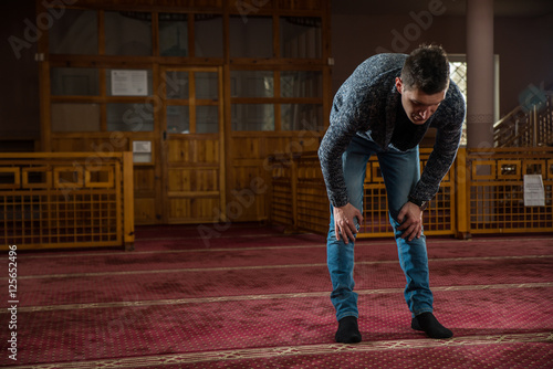 Muslim praying in mosque