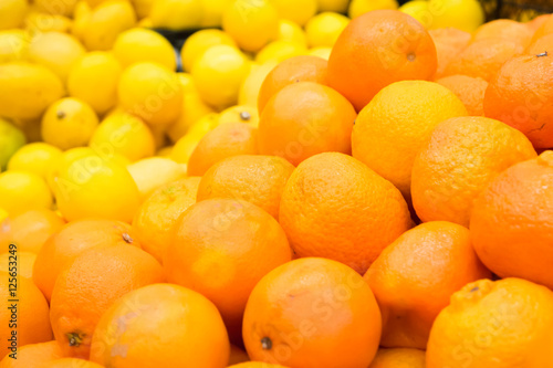 Pile of fresh oranges and lemons