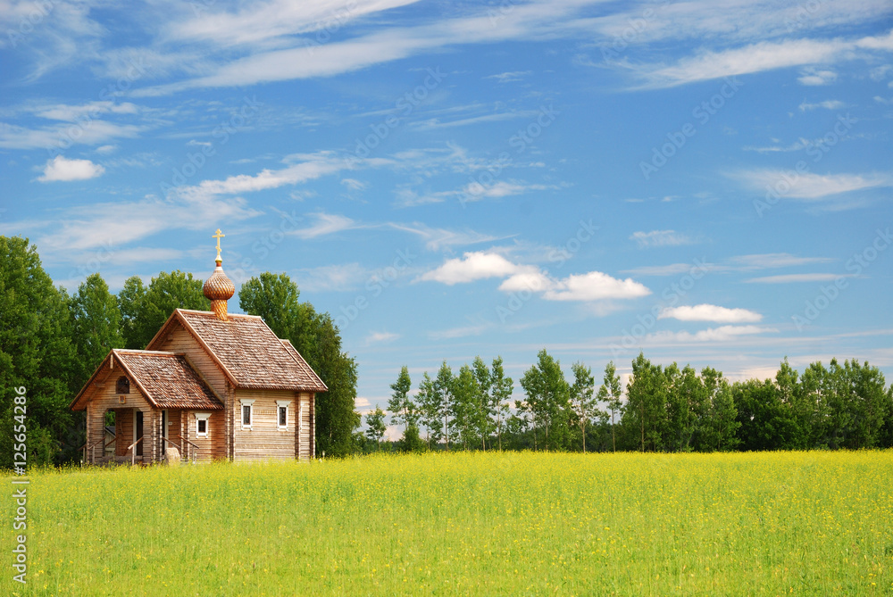 Obraz premium Finnish landscape with small wooden church.
