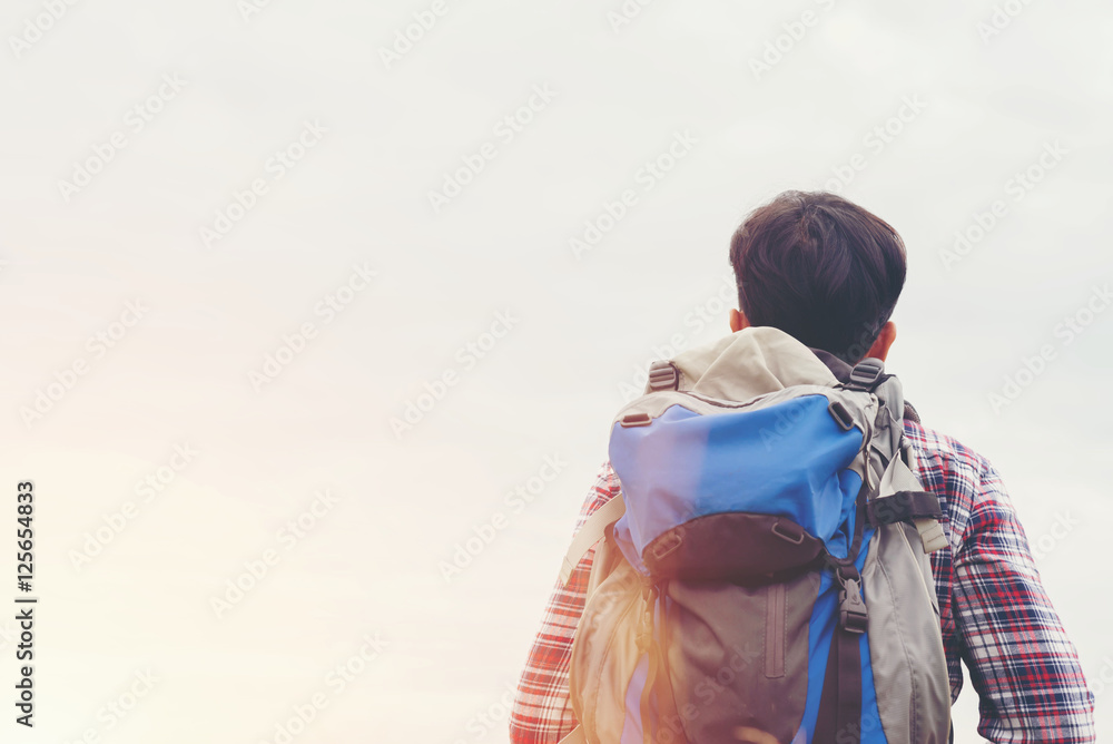 Fototapeta premium Traveler Man with backpack,Travel Lifestyle concept mountains on