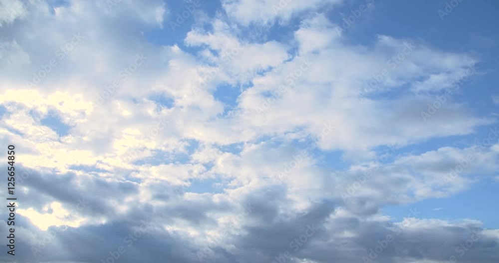 clouds timelapse and sunrise breaking through cloud mass. clouds timelapse and sunrise breaking through cloud mass.