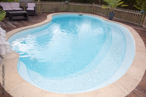 Beautiful house, swimming pool nobody inside, summer day