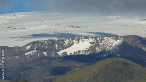 high mountains covered glacier, volcano Katla, glacier Myrdalsjokull, southern coast of Iceland photo