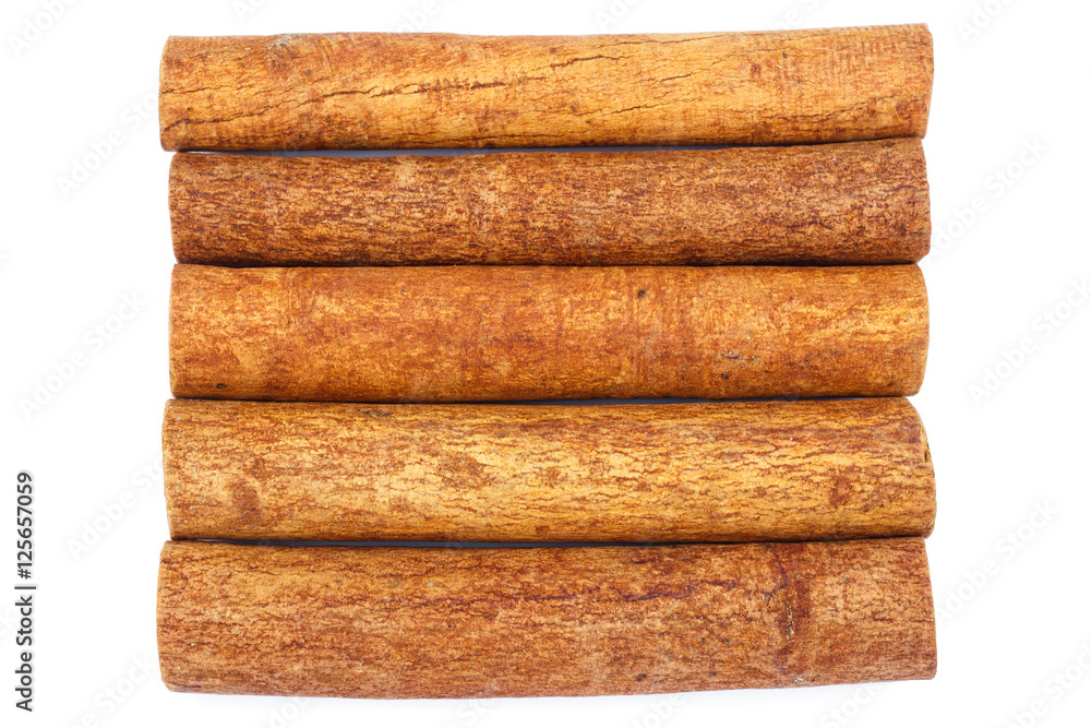 Group of cinnamon sticks isolated on white background, top view Group of cinnamon sticks isolated on white background, top view