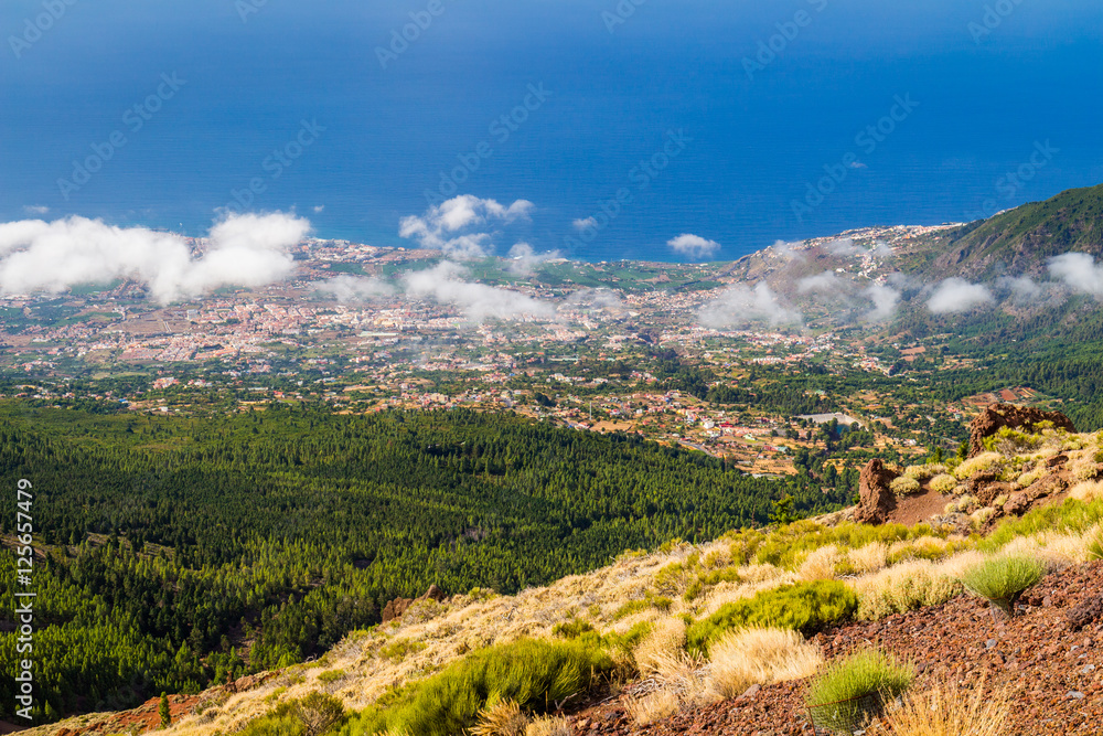 The slopes of the volcano Teide on Tenerife island towering above a rare cloud at its foot. Spain.