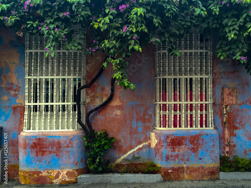 House window with wooden bars in Cartagena, Colombia